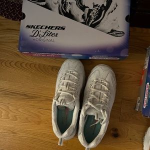 2 pair white 8.5 wide Sketchers.  Hardly worn toe box too small.